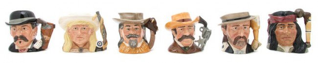 A Collection of Toby Mugs, Royal Doulton Height of: A Collection of Toby Mugs, Royal Doulton Western Series, comprising Annie Oakley, Wild Bill Hickok, Geronimo, Doc Holiday, Buffalo Bill and Wyatt Earp; 6 items total. Height of tallest 5 1/2 inches. P