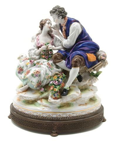 A Dresden Porcelain Figural Group, Height overall: A Dresden Porcelain Figural Group, depicting a courting couple, set in a gilt metal oval base, formally mounted as a lamp, with crowned N mark. Height overall 11 inches. Property of a Lady, Oakbrook,