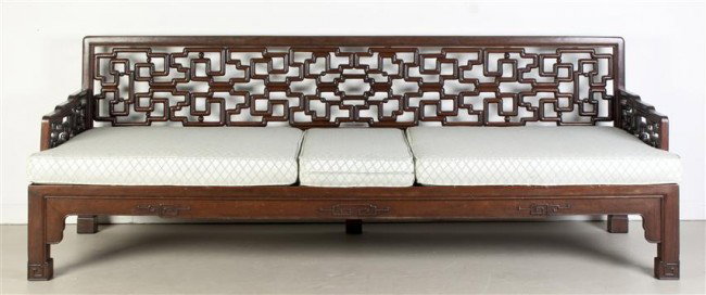 A Chinese Hardwood Settee, Height 28 inches.: A Chinese Hardwood Settee, of rectangular form with pierced lattice back and arms, raised upon four squat legs terminating in spade feet. Height 28 inches. Property from the Estate of Tom G. and Mary 