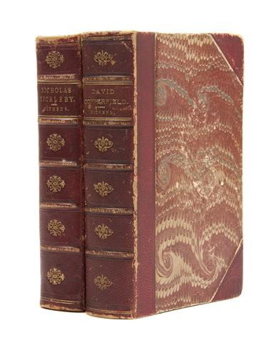 DICKENS, CHARLES. Nicholas Nickleby. London, 1839.: DICKENS, CHARLES A group of two first editions, mixed states. 2 vols. 8vo, 3/4 red morocco over marbled boards, gilt-lettered spines, marbled edges and endpapers. The Life and Adventures of Nicholas N