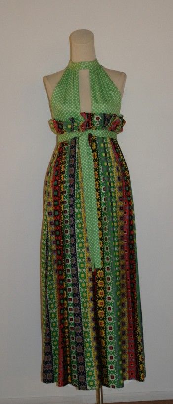Donald Brooks Print Knit Evening Dress: Donald Brooks Print Knit Evening Dress 1970s Multi-patterned dress. Halter front high bodice of green and white knit with band collar. Skirt of multi-colored geometric knit has gathered paper-bag wais