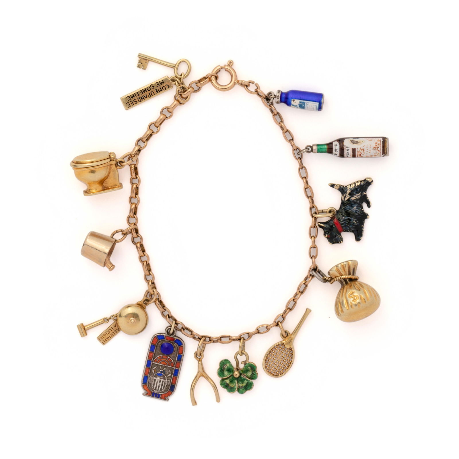 YELLOW GOLD CHARM BRACELET: YELLOW GOLD CHARM BRACELET Consisting of a fancy link chain suspending a key COME UP AND SEE ME SOME TIME charm, a toilet charm with hinged cover, a wine bucket charm, an ALLRIGHT ALLRIGHT bell charm,