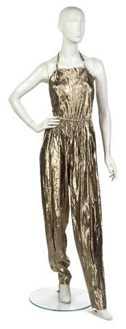 A Stephen Burrows Gold Lame Jumpsuit,: A Stephen Burrows Gold Lame Jumpsuit, worn on tour at Madison Square Garden. Labeled: Stephen Burrows. Property from the Collection of Gladys Knight, Las Vegas, Nevada