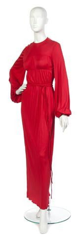 A Bill Blass Red Silk Jersey Evening Gown,: A Bill Blass Red Silk Jersey Evening Gown, early 1970s, original sample, with panels of gathered fabric at bodice, matching rope belt at waist, full length sleeves. Labeled: Bill Blass.