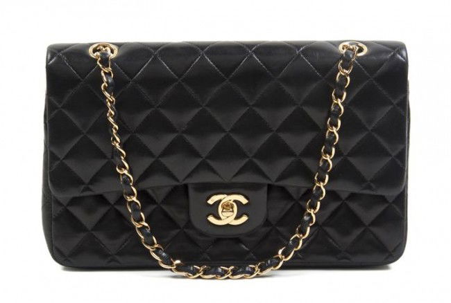 A Chanel Black Quilted Leather Bag, 10 x 7 inches.: A Chanel Black Quilted Leather Bag, with chainlink adjustable strap, logo flap closure. Stamped: Chanel. 10 x 7 inches.