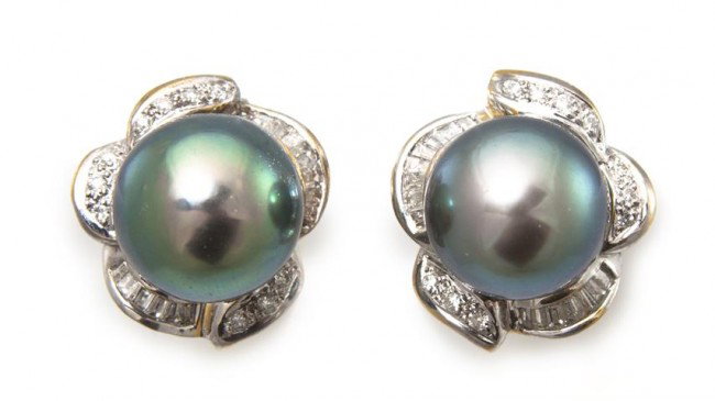 A Pair of 18 Karat White Gold, Cultured Tahitian P: A Pair of 18 Karat White Gold, Cultured Tahitian Pearl and Diamond Earclips, containing two pearls measuring approximately 10.90 mm in diameter and numerous round brilliant and baguette cut diamonds w