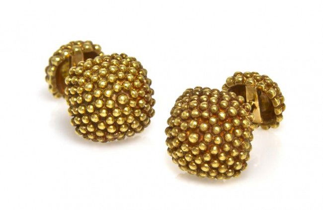 A Pair of 18 Karat Yellow Gold Cufflinks, 12.00 dw: A Pair of 18 Karat Yellow Gold Cufflinks, in a domed granulated design. Stamp: 18K. 12.00 dwts. Property from the Collection of Governor Jim Thompson, Chicago, Illinois