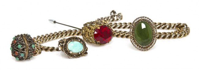 A Group of Jewelry,: A Group of Jewelry, consisting of a silver and jade brooch, a goldtone stickpin, and a red stone and turquoise chain link necklace with a locket.