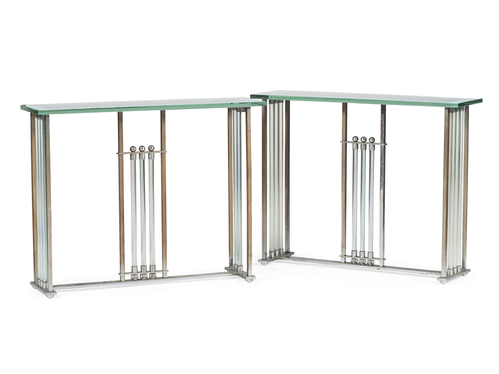 A Pair of Chrome and Glass Console Tables: A Pair of Chrome and Glass Console Tables Continental, 20th Century Height of each 33 x width 39 1/2 x depth 10 1/2 inches.