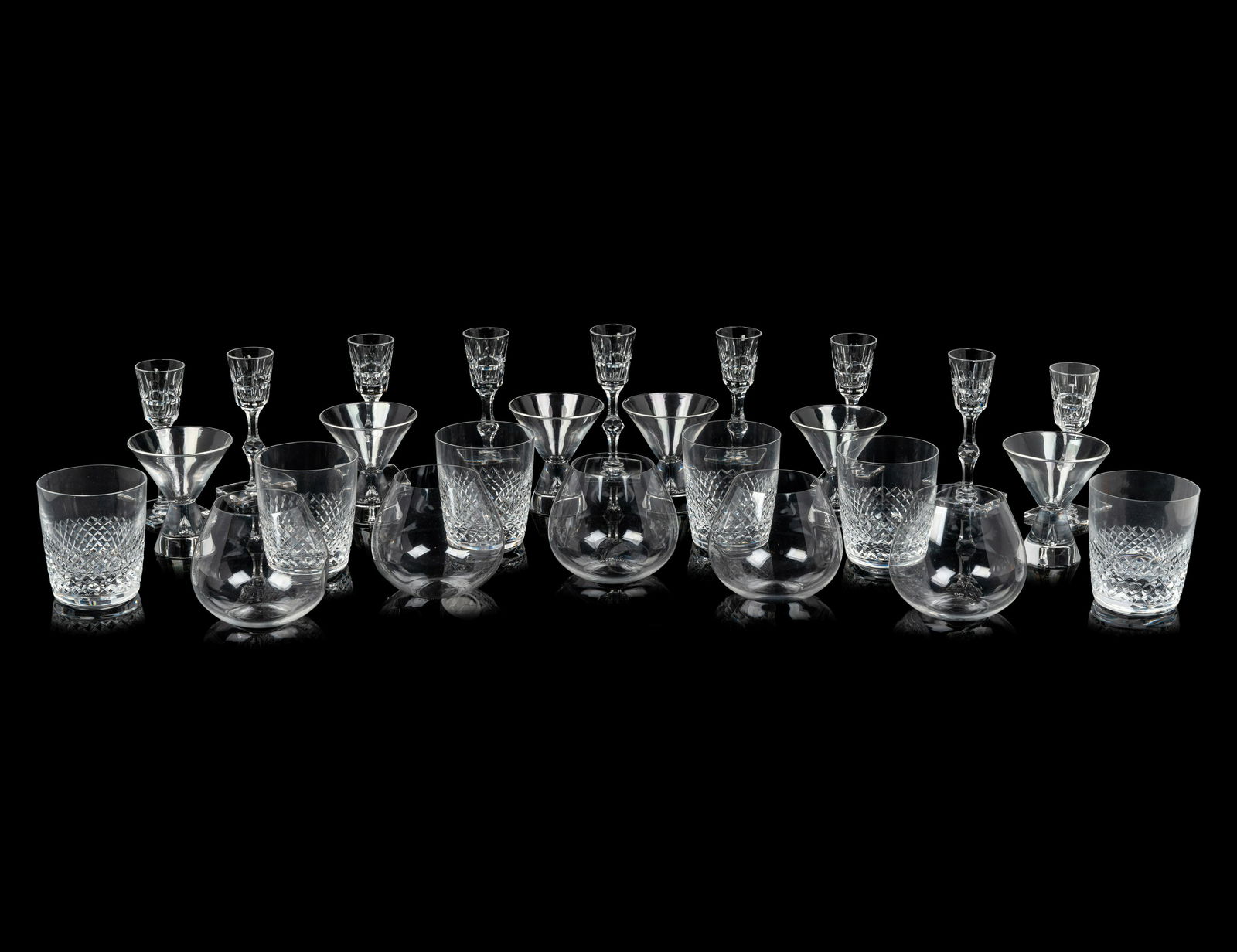 A Group of Assorted Glasses Height of first 3 3/4 inches.: A Group of Assorted Glasses comprising six Lalique old fashioned glasses, six Steuben martini glasses, nine Hawkes cordials and five Tiffany-Peretti stemless wine glasses; 26 items total. Height of fi