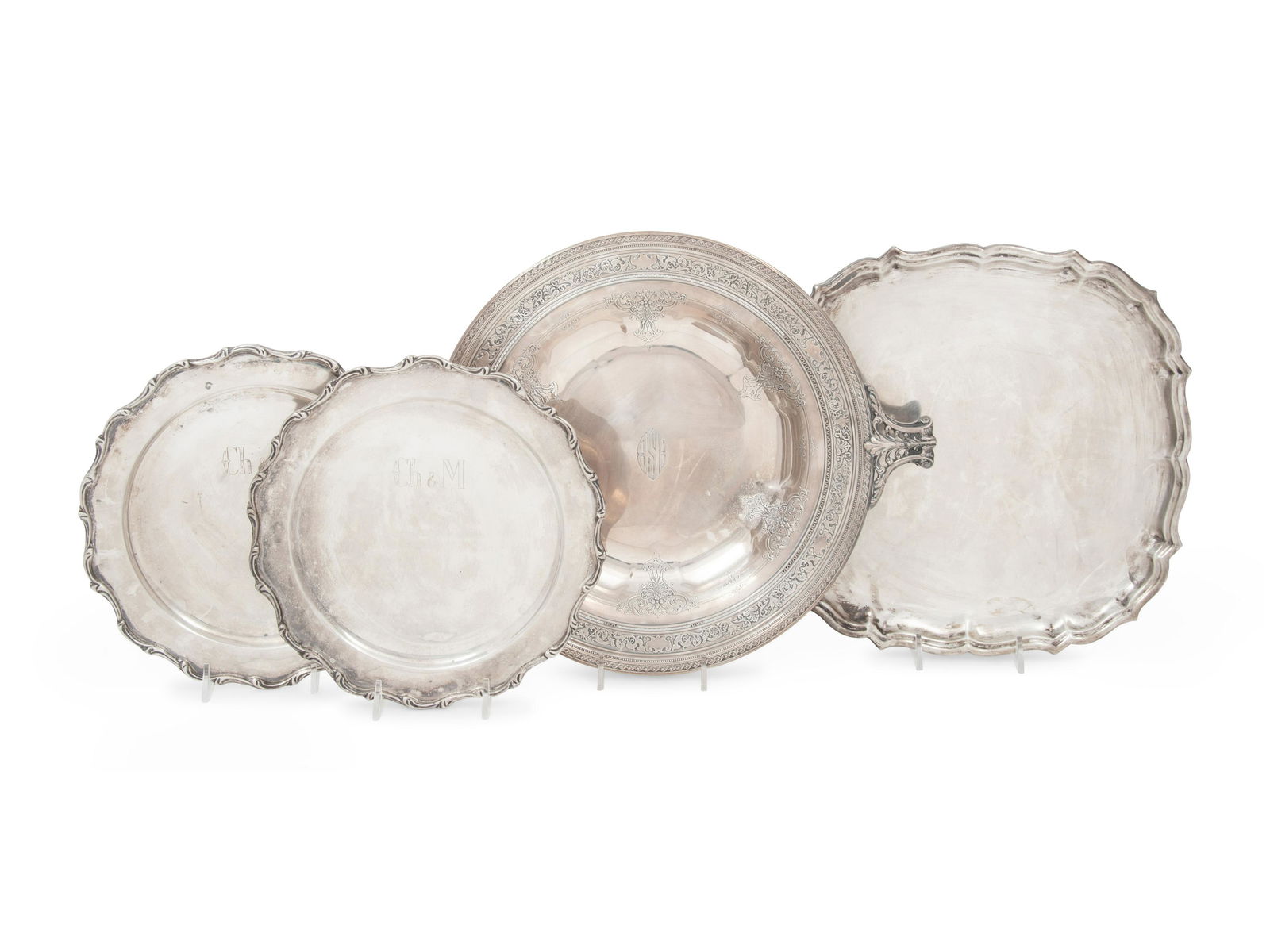 A Group of American and Mexican Silver Articles Width over handles of largest example 14 1/4 inches.: A Group of American and Mexican Silver Articles 20th Century comprising a square tray, a round pedestal tray with handles and two small round trays. each marked 'Sterling' to underside 54 ozt 12 dwt g