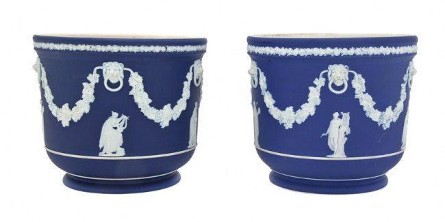 An Assembled Pair of Wedgwood Jasperware Cache Pot: An Assembled Pair of Wedgwood Jasperware Cache Pots, each with festoon, lion mask and classical figural decoration, one marked Wedgwood/F and the other Wedgwood/R/England. Height 6 1/2 inches.