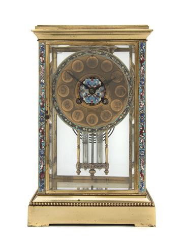A French Gilt Metal and Champleve Mantel Clock, He: A French Gilt Metal and Champleve Mantel Clock, having a stepped rectangular top over the segmented circular dial with Arabic numerals, with Japy Freres time and strike movement. Height 10 3/4 inches.