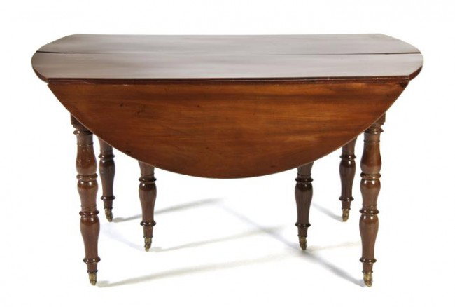 A Louis Philippe Cuban Mahogany Extension Dining T: A Louis Philippe Cuban Mahogany Extension Dining Table, having an oval top over the plain frieze, raised on turned legs, with three 18 1/2 inch leaves. Height 27 3/4 x width 24 1/4 x depth 49 1/4 inch