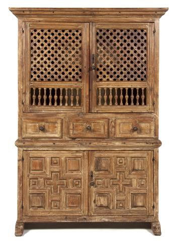 A Spanish Fruitwood Sacristy Cabinet, Height 69 5/: A Spanish Fruitwood Sacristy Cabinet, likely 18th century, having a flared cornice over two latticed and spindled panel doors above three drawers and two coffered doors, raised on sledge feet. Height