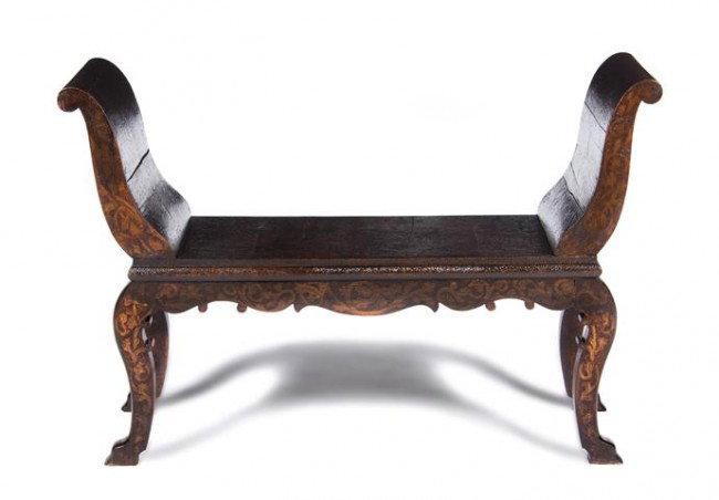 A Continental Window Bench, Width 48 inches.: A Continental Window Bench, having outswept arms over the plank seat, raised on scrolling legs, having pyrographic, pressed and allover leaf decoration. Width 48 inches.