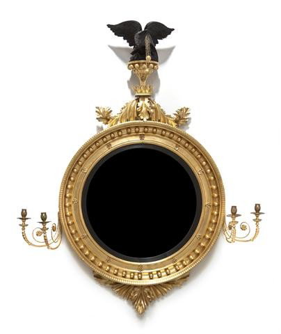 An American Federal Bullseye Mirror, Height 55 1/2: An American Federal Bullseye Mirror, surmounted with an ebonized eagle and acanthus carved crest over the convex plate, each two-light girandole issuing scrolling candle arms. Height 55 1/2 inches. Pr