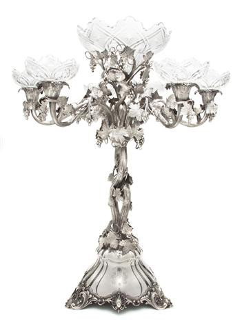 An English Silver and Cut Glass Epergne, Alexander: An English Silver and Cut Glass Epergne, Alexander Macrae, retailed by A.B. Savory and Sons, London, 1860, cast in the form of intertwining grapevines issuing the conforming arms, the center and arms 