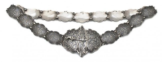 A Russian Silver and Niello Belt, Length 28 3/4 in: A Russian Silver and Niello Belt, having various marks, the seventeen segments and buckle each with all over scrolling decoration, with scimitar clasp; approximate total weight 4.24 ozt. Length 28 3/4