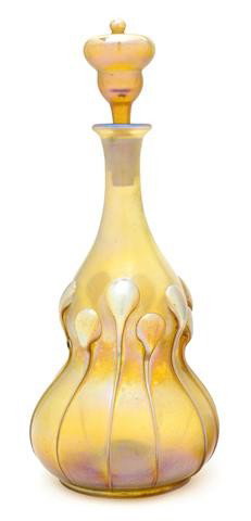 A Tiffany Studios Iridescent Glass Perfume Bottle,: A Tiffany Studios Iridescent Glass Perfume Bottle, having applied dripped glass and stopper, signed L.C.T. G1577, retaining partial paper label. Height overall 9 5/8 inches. Property from the Estate o
