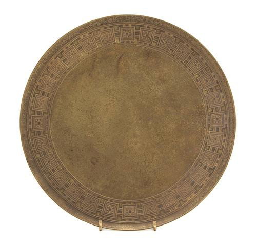 A Tiffany Studios Bronze Footed Bowl, Diameter 9 3: A Tiffany Studios Bronze Footed Bowl, having a dore finish and geometric border, impressed Tiffany Studios New York 1744. Diameter 9 3/4 inches. Property from the Estate of John Haight, Arlington Heig