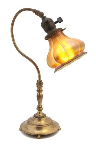 An American Gilt Metal Desk Lamp, Height 15 1/2 in: An American Gilt Metal Desk Lamp, with a Steuben Aurene glass shade over the baluster standard and circular foot. Height 15 1/2 inches. Property from the Estate of John Haight, Arlington Heights, Illi