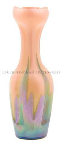 An Austrian Iridescent Glass Vase: An Austrian Iridescent Glass Vase, of bottle form, with ruffled rim, the lobed body having pulled decoration, signed with spurious marks for Loetz Austria. Height 14 inches.