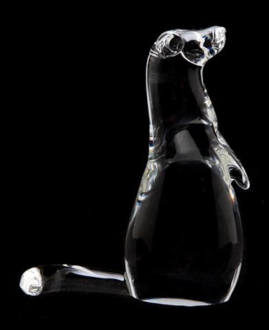 A Steuben Glass Figure, Mink Vertical, Height 6 1: A Steuben Glass Figure, Mink Vertical, designed by Lloyd Atkins, 1976, depicted in a standing pose with diamond inset eyes, having an engraved signature, style number 8334. Height 6 1/2 inches.