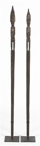 A Group of Two Dayak Architectural Male Shrine Po: A Group of Two Dayak Architectural Male Shrine Posts, Borneo, each having figure at top with conical hat, raised upon a squared tapering shaft with heavy patina throughout. Height of tallest 49 1/4 in