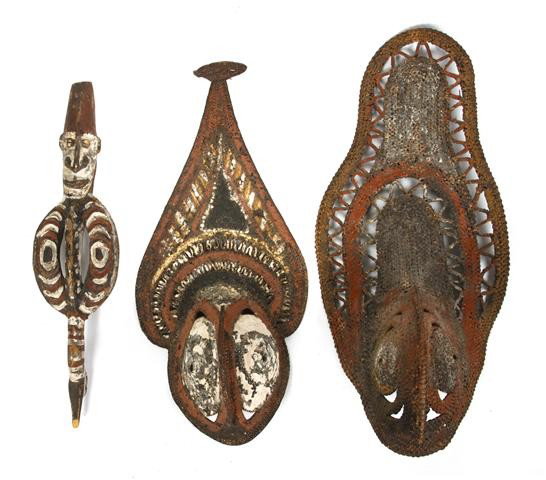 A Group of Sepik River Valley Articles, New Guine: A Group of Sepik River Valley Articles, New Guinea, comprising an ancestral totem figure in red ochre, white and black pigments and two woven reed masks. Height of tallest 20 inches. Property from the