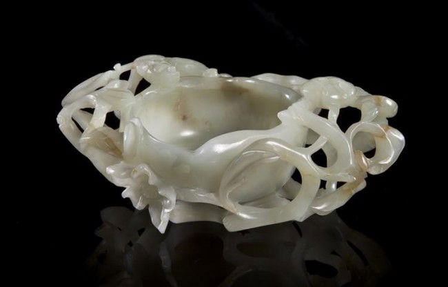 A Jade Plum-Form Cup, Width 4 1/4 inches.: A Jade Plum-Form Cup, of pale celadon colored stone, the bowl surrounded by pierced branches and blossoms. Width 4 1/4 inches. Property from the Collection of Mr. and Mrs. John F. Monroe, Milwaukee, W