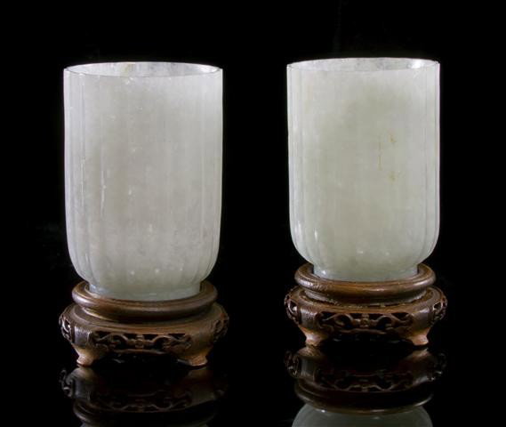 A Pair of White Jade Cups, Height 2 3/4 inches.: A Pair of White Jade Cups, carved of white stone with opaque inclusions, the cups having straight walls with fluted exteriors. Height 2 3/4 inches. Property from the Collection of Dr. Samuel Grant, Ch