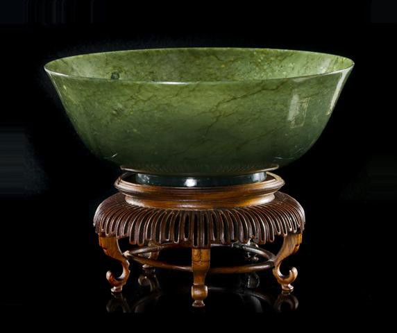 A Spinach Jade Bowl, Diameter 7 1/2 inches.: A Spinach Jade Bowl, of dark green stone, with slight bell curve form to the walls, raised atop a circular foot. Diameter 7 1/2 inches. Property from the Collection of Dr. Samuel Grant, Chicago, Illin
