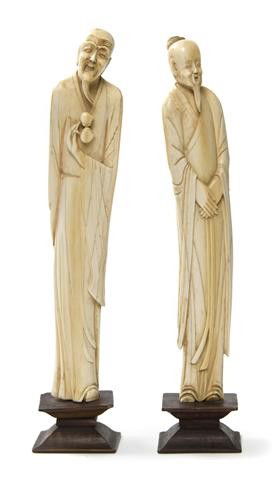 A Pair of Chinese Ivory Figures, Height of tallest: A Pair of Chinese Ivory Figures, depicting standing Daoist scholars in flowing robes, raised upon rectangular wood bases. Height of tallest 11 3/4 inches.