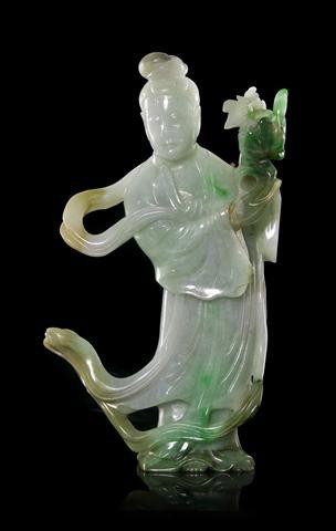 A Chinese Carved Jade Figure, Height 7 1/2 inches.: A Chinese Carved Jade Figure, in pale green with splashes of apple green and lavender color, depicting a standing maiden holding a bouquet of flowers. Height 7 1/2 inches. Property from the William H.