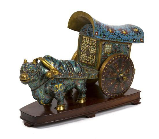 A Cloisonne Model of an Ox and Cart, Height 9 7/8 : A Cloisonne Model of an Ox and Cart, showing the animal pulling the cart with cloisonne decoration throughout with gilt perimeters. Height 9 7/8 x width 17 3/4 inches. Property of a Private Collector,