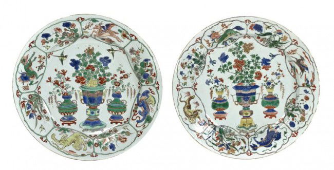 A Group of Two Famille Verte Plates, Diameter 13 i: A Group of Two Famille Verte Plates, 18th century, the central panel depicting a garniture set with blossoming flowers, the borders containing eight panels showing alternating floral and animal motifs
