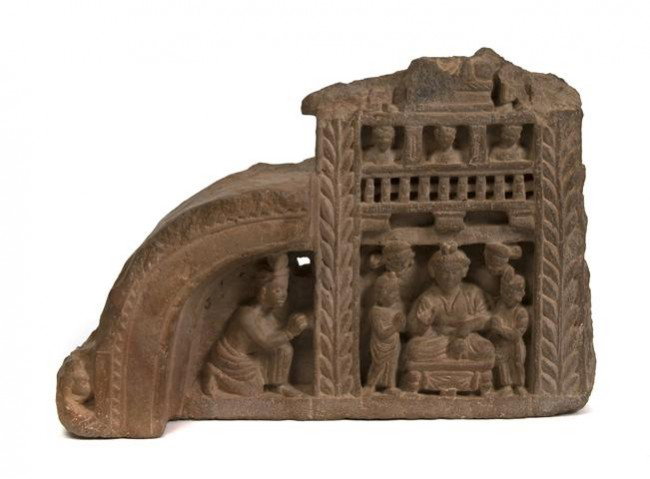 A Southeast Asian Carved Stone Frieze, Height 8 in: A Southeast Asian Carved Stone Frieze, of iron red colored sandstone, depicting a figural scene. Height 8 inches.