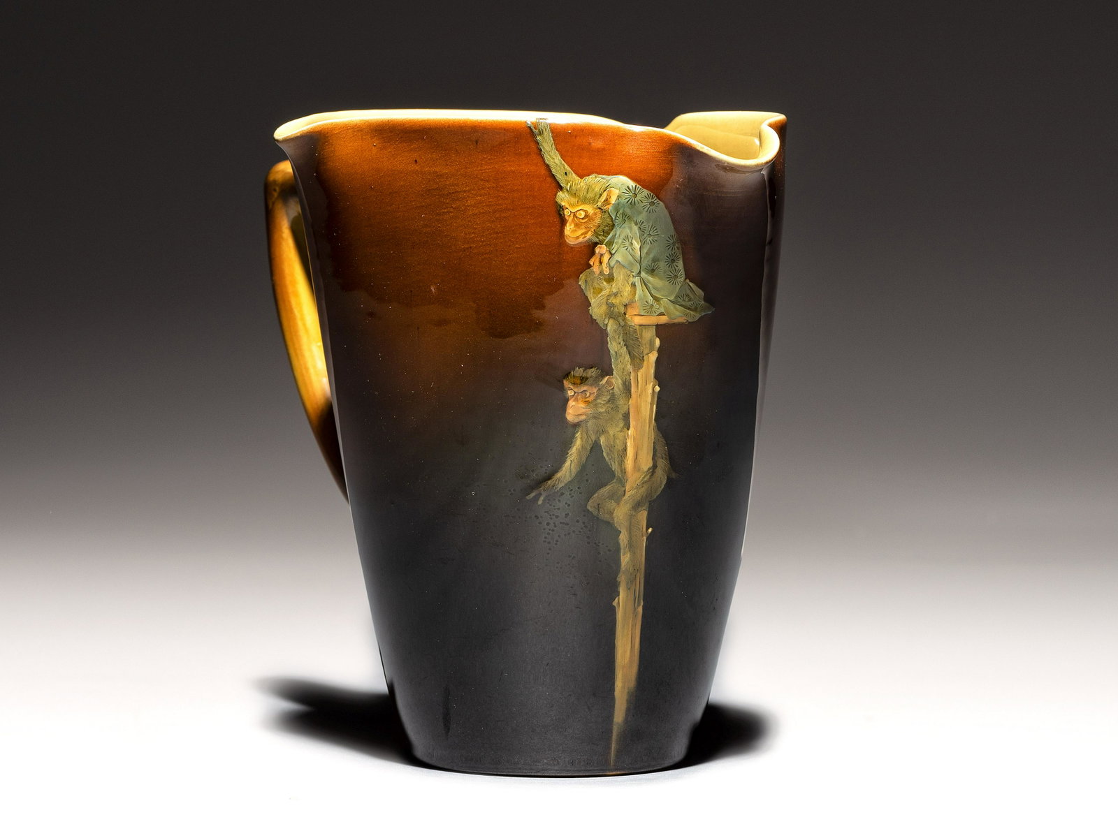Kataro Shirayamadani for Rookwood Pottery (Japanese, 1865-1948) Standard Glaze Tri-Corner Pitcher: Kataro Shirayamadani for Rookwood Pottery (Japanese, 1865-1948) Standard Glaze Tri-Corner Pitcher with Monkey Decoration, 1889 glazed earthenware impressed manufacturer's mark, date mark and number '2