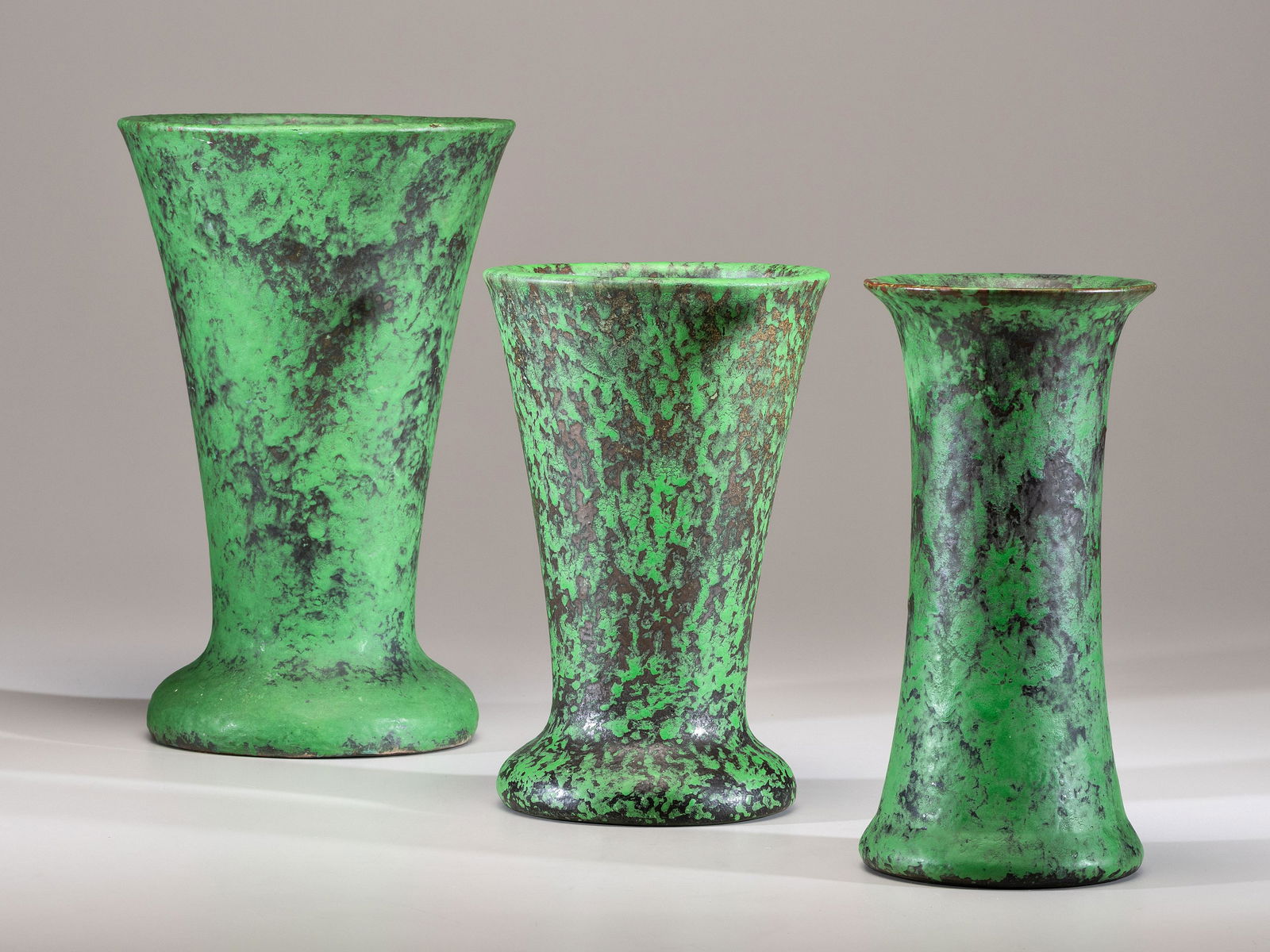 Weller Pottery American, Early 20th Century Three Coppertone Vases: Weller Pottery American, Early 20th Century Three Coppertone Vases glazed earthenware two marked 'Weller Hand Made,' one marked 'Weller Pottery' to underside H of tallest 15 1/4 inches.