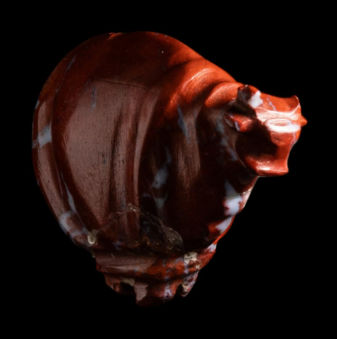 An Egyptian Red Jasper Trussed Ox Length 15/16 inches (2.38 cm). (1 of 4)