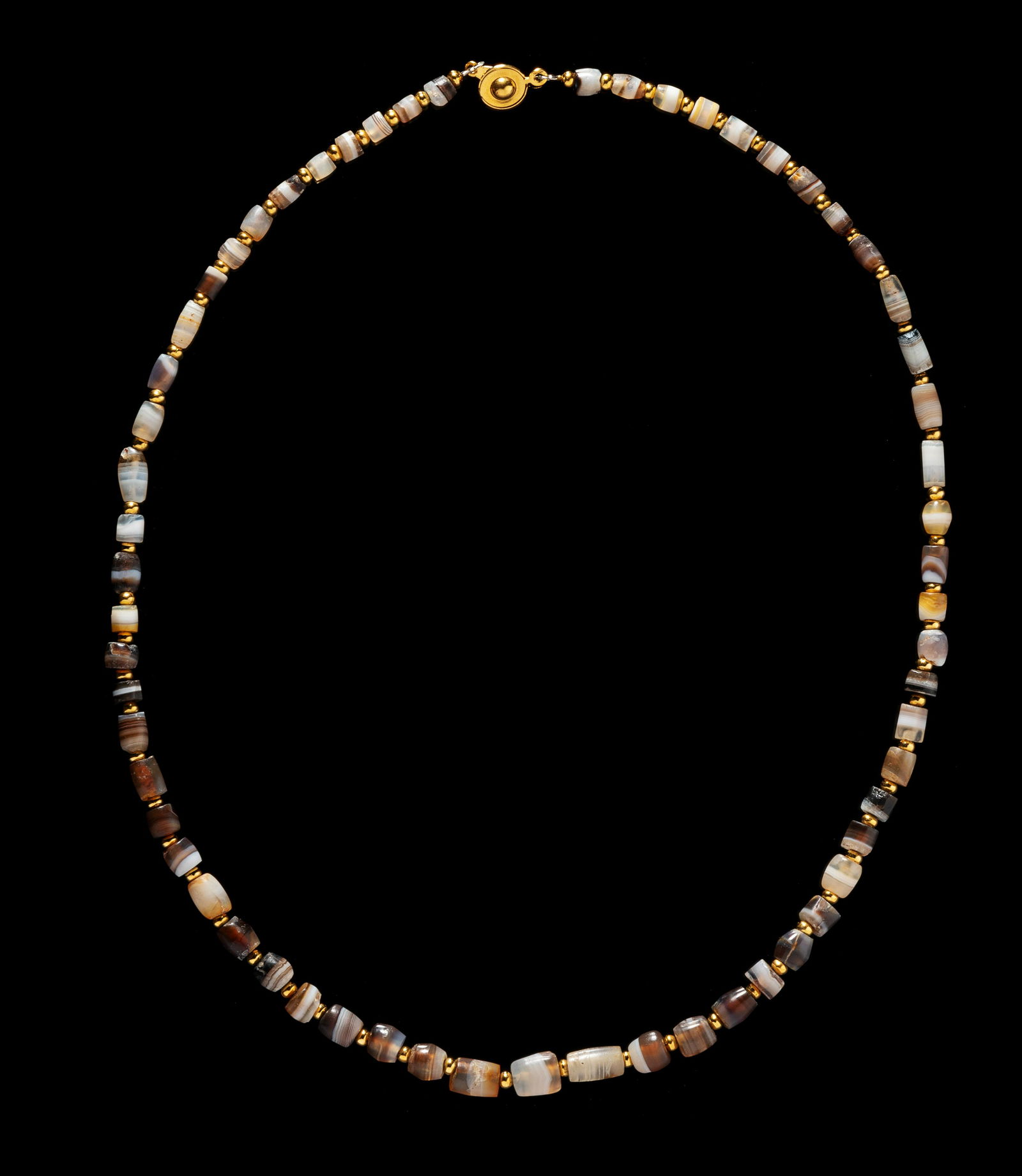 A Western Asiatic Banded Agate Necklace  Length 20 3/8 inches (31.7 cm). (1 of 2)