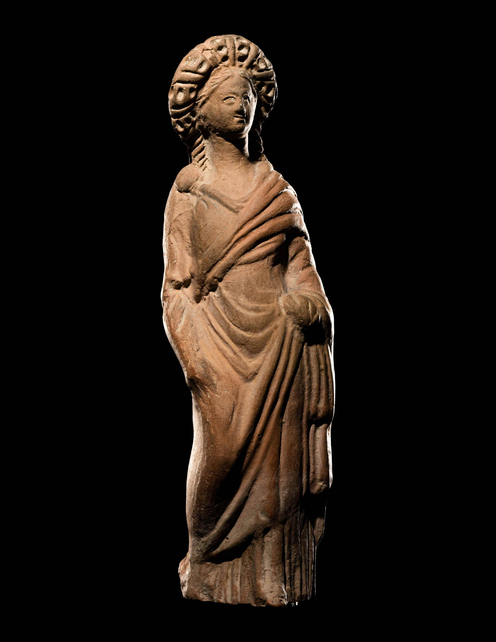 A Greek Terracotta Standing Draped Female Height 5 1/2 inches (14 cm).: A Greek Terracotta Standing Draped Female Circa 4th-3rd Century B.C. Height 5 1/2 inches (14 cm). Property from the Collection of Mr. Felix Brejente, Schaumburg, Illinois Provenance: James D. Eckerlin