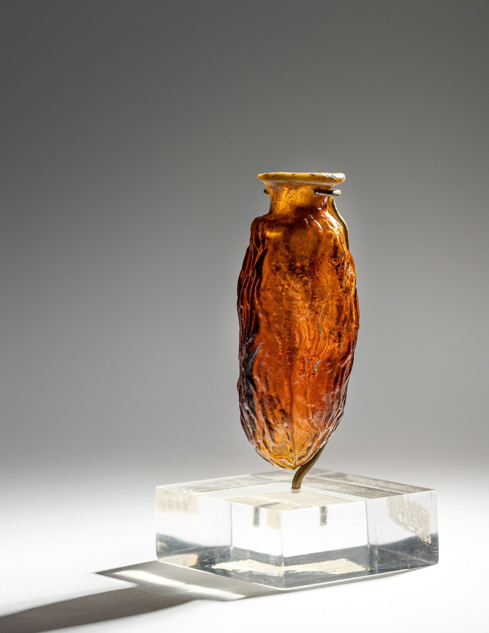 A Roman Amber Glass Date Flask  Height 3 inches (8 cm). (1 of 4)