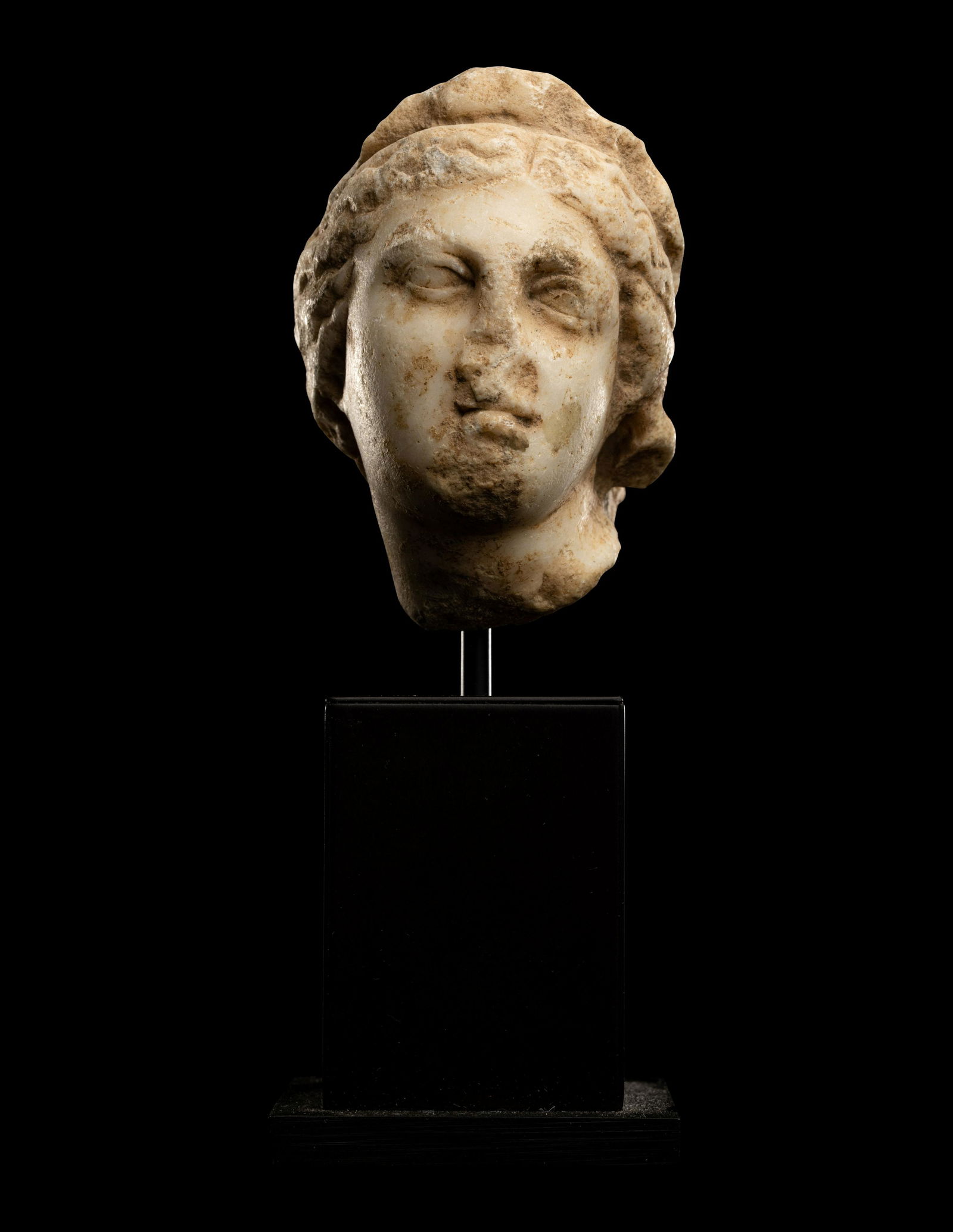 A Roman Marble Head of a Woman Height 3 3/16 inches (8.1 cm). (1 of 3)