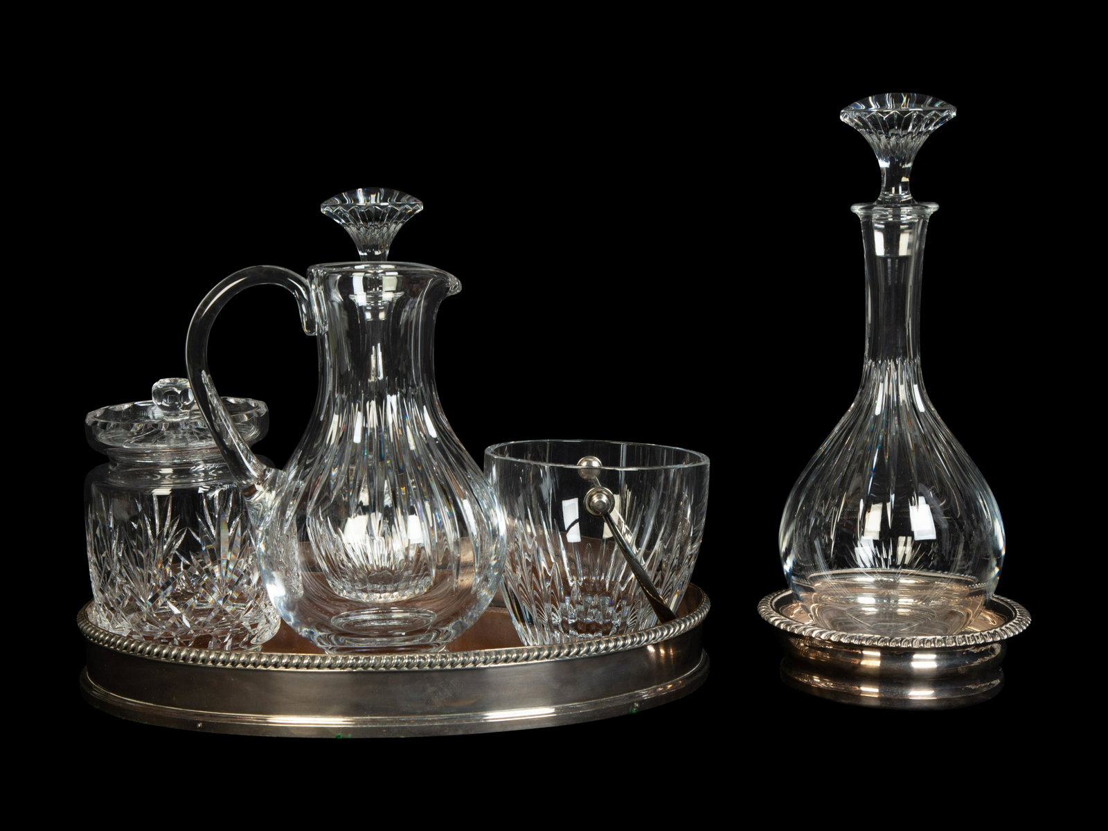 A Group of Baccarat Massena and Other Barware Articles Height of tallest decanter 13 inches.: A Group of Baccarat Massena and Other Barware Articles Late 20th/Early 21st Century comprising two Baccarat decanters, a Baccarat pitcher and a Baccarat ice bucket, all with acid etched signature unde