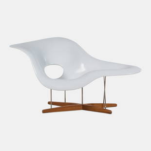 After Charles and Ray Eames 21st Century Sculptural Chaise Lounge, c. 2000s: After Charles and Ray Eames 21st Century Sculptural Chaise Lounge, c. 2000s lacquered polyurethane, oak, chrome-plated steel unmarked H 33 1/4 x W 59 x D 34 inches