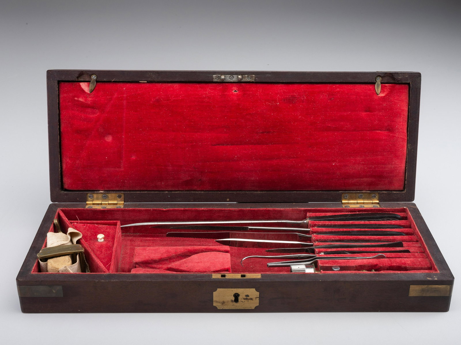 [CIVIL WAR]. War-period amputation kit by H. Hernstein, New York. : [CIVIL WAR]. War-period amputation kit by H. Hernstein, New York. Velvet-lined wooden box with brass fittings and unmarked cartouche, 17 1/4 x 6 1/4 x 3 in. (one tool missing from slot; general 