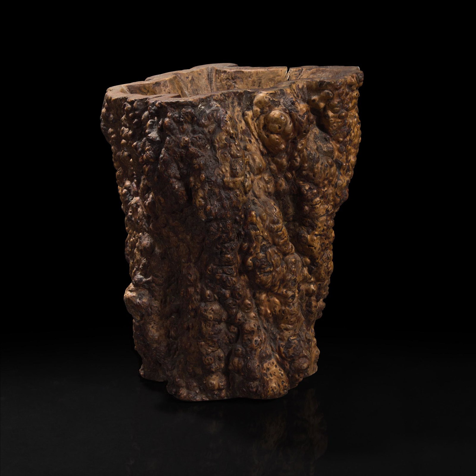 A burlwood brush pot: Of flared form, with irregular burled rim and sides. (H: 9 in.) PROVENANCE: Property from a Private Collection, New York