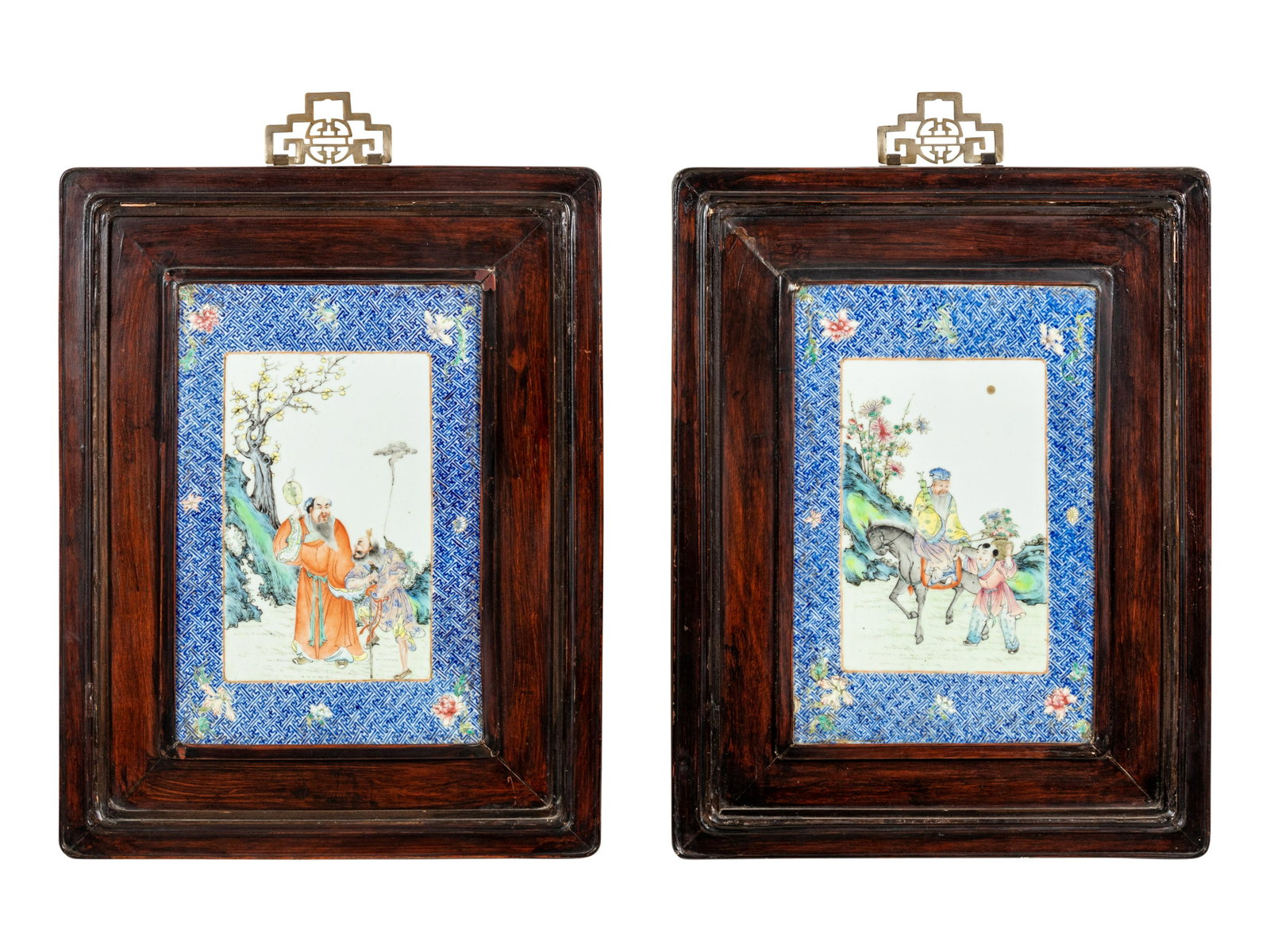 A Pair of Chinese Famille Rose Porcelain Plaque Inset Hanging Screens: A Pair of Chinese Famille Rose Porcelain Plaque Inset Hanging Screens 19TH CENTURY each plaque deftly painted to show immortals gathering in a landscape, all bordered by a blue ground of interlocking 